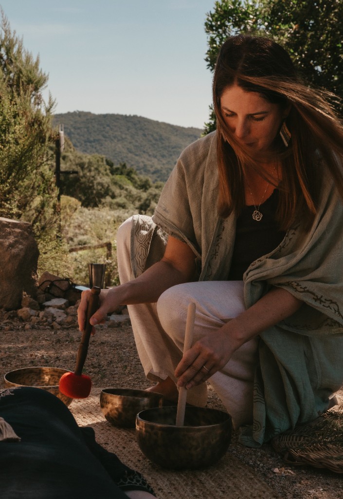 Olivia facilitating sound healing outdoors